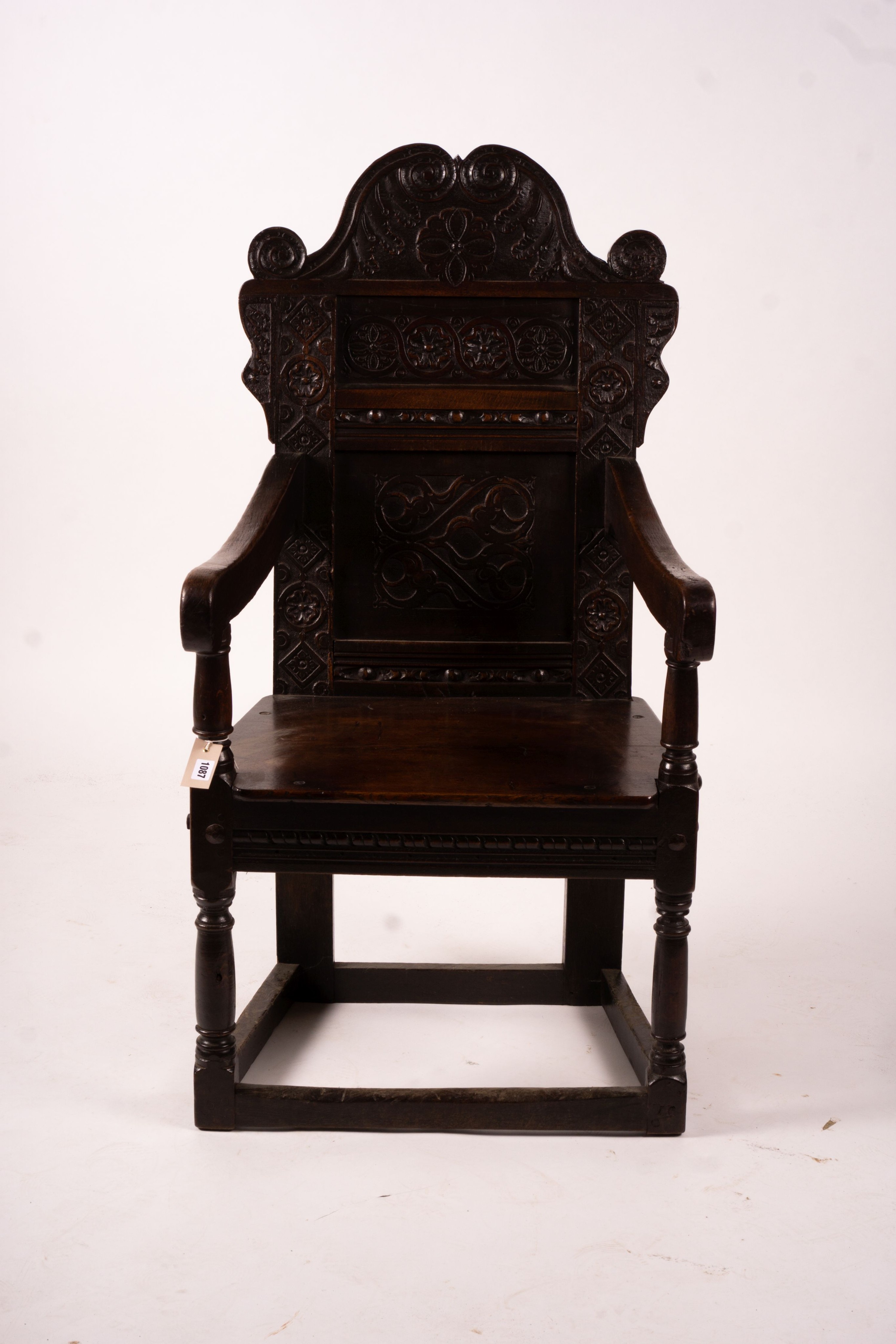 A 17th century Yorkshire area carved oak wainscot chair, width 62cm, depth 48cm, height 118cm